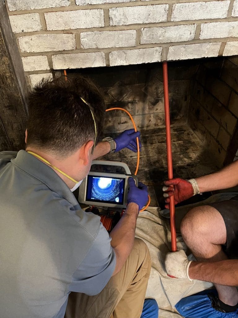 A chimney inspection being performed after a chimney sweep in Chesapeake, VA.