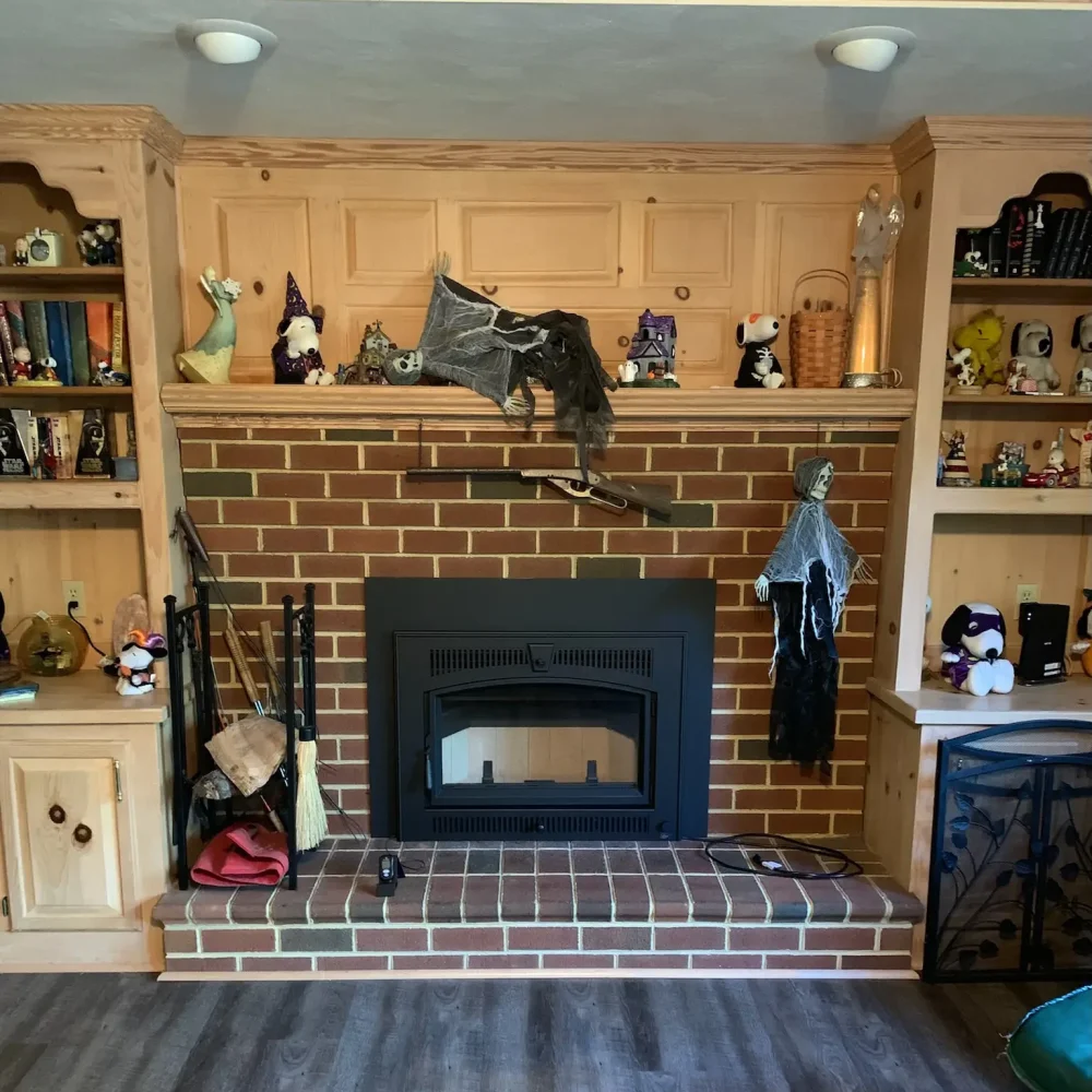 Wood stove insert installed in Virginia Beach, VA with insulated flue liner extending to the top of the chimney.