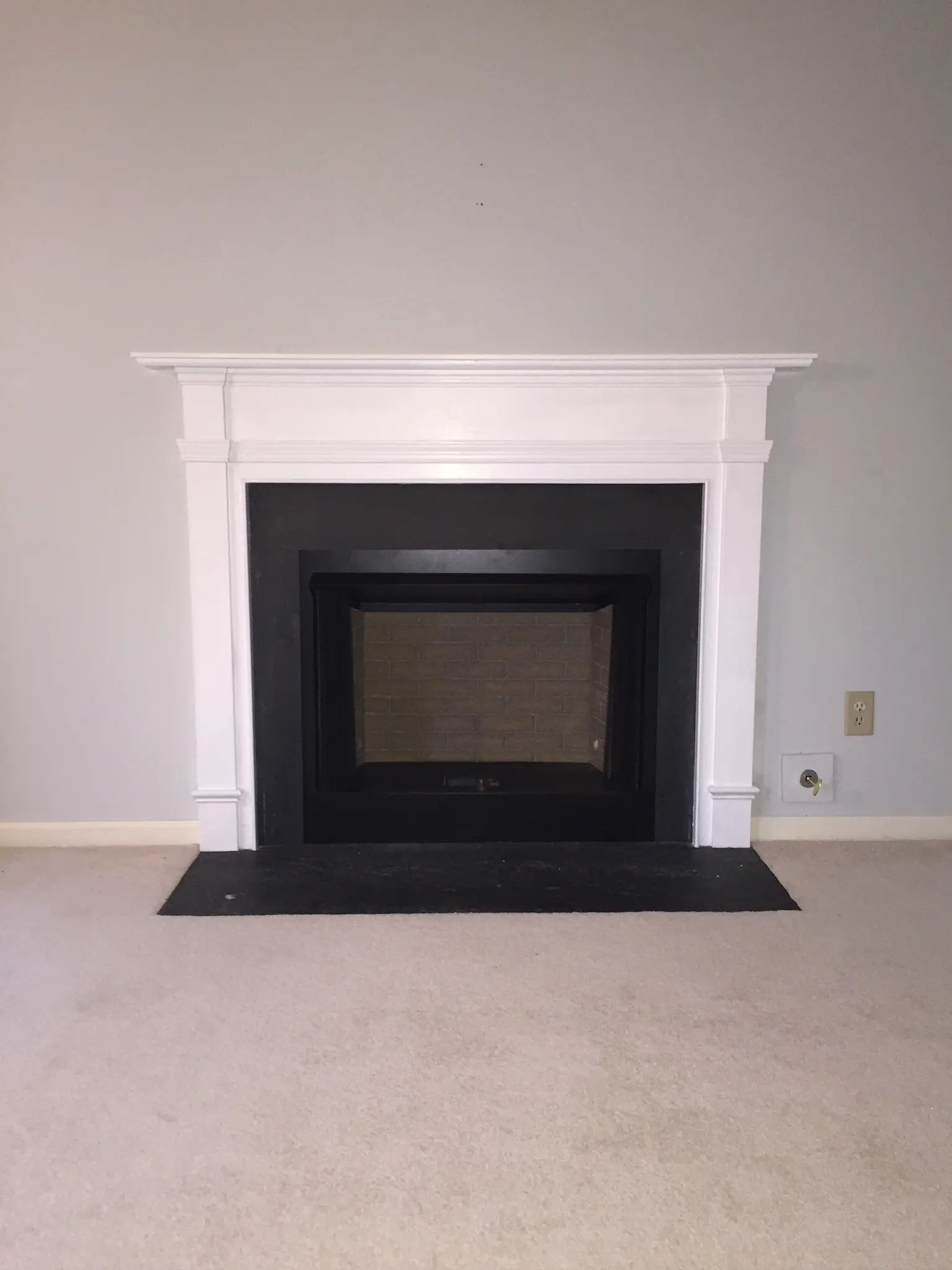 New prefab fireplace with slate trim in Chesapeake, VA