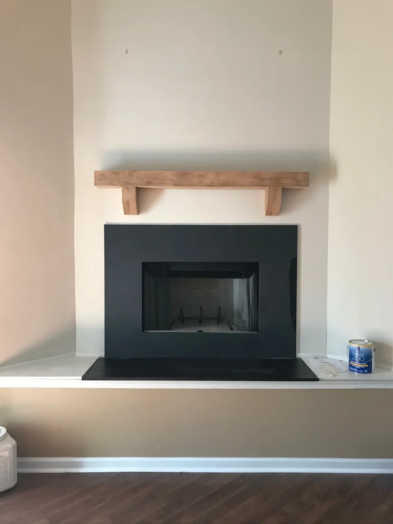 New prefab fireplace in Virginia Beach, VA with new slate trim and custom mantel.