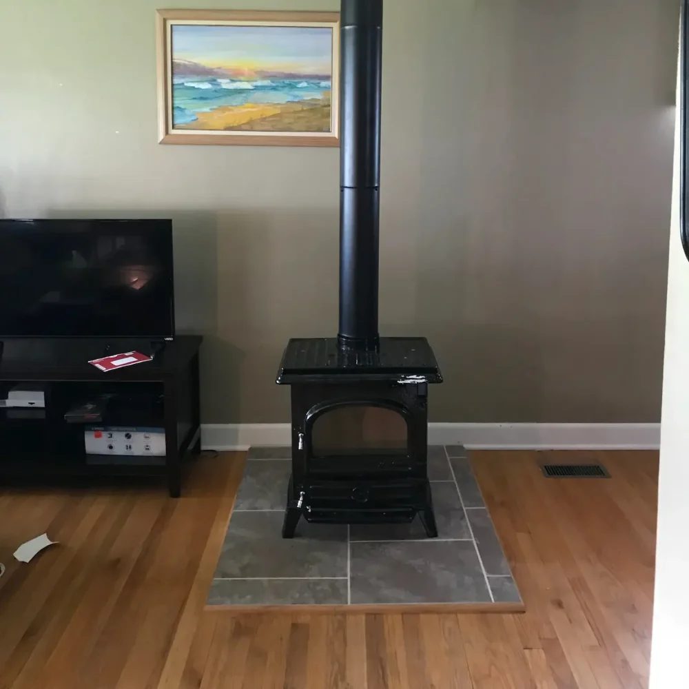 free standing wood stove service in Norfolk, VA by Premier Chimney and Roofing.
