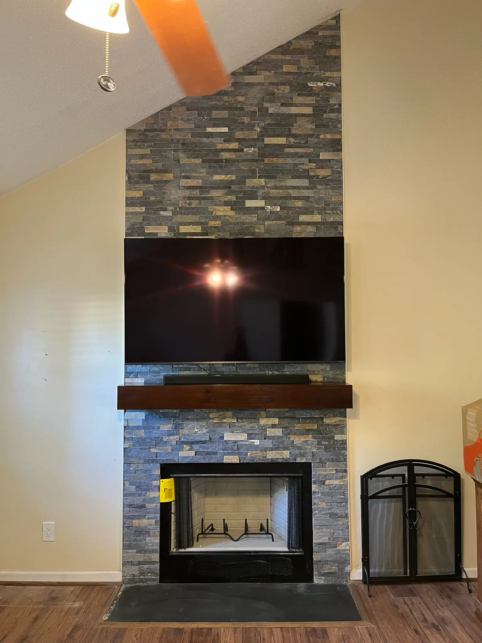 New prefab fireplace in Chesapeake, VA with stacked stone from floor to ceiling.