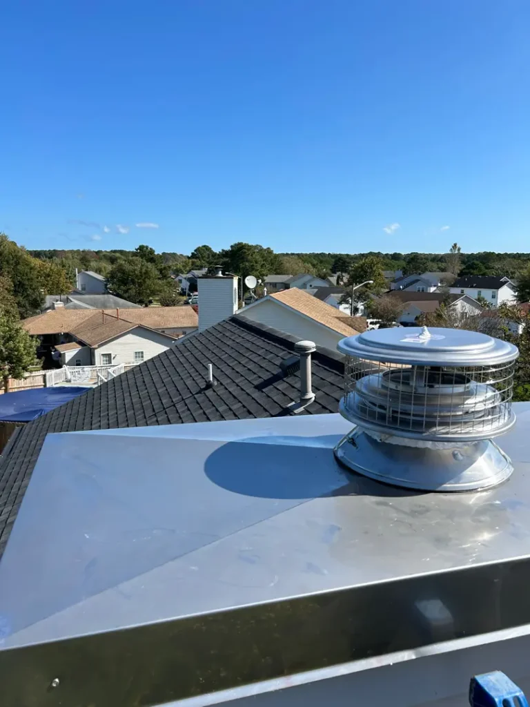 chimney chase cover and prefab chimney cap in Virginia Beach by Premier Chimney and Roofing.