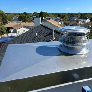 chimney chase cover and prefab chimney cap in Virginia Beach by Premier Chimney and Roofing.