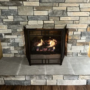 gas fireplace log service by Premier Chimney and Roofing.
