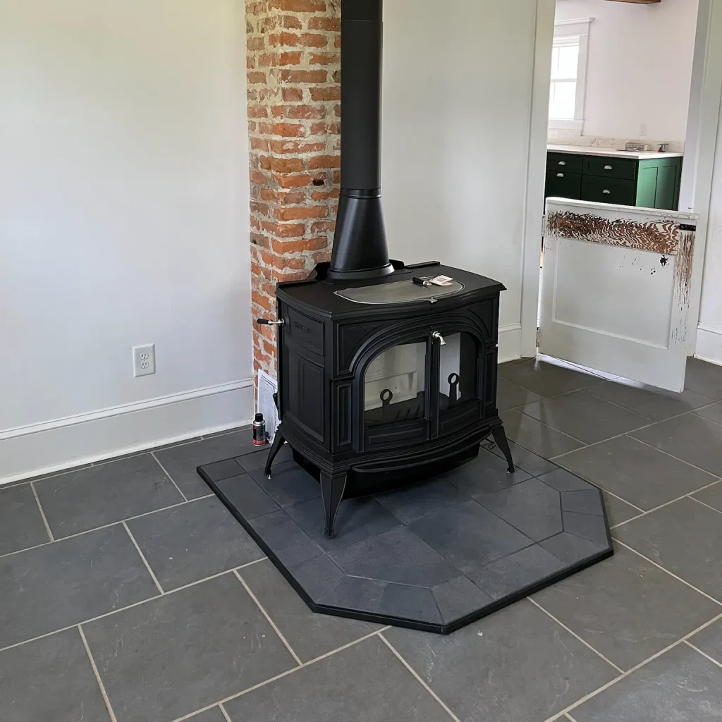 Wood stove installation in Hampton, VA by Premier Chimney and Roofing.