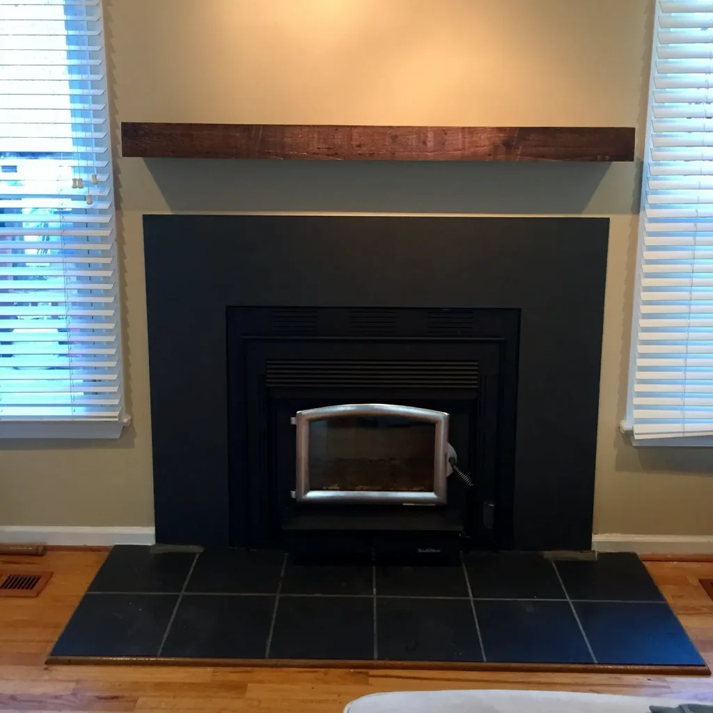 Wood burning stove installation in Norfolk, VA by Premier Chimney and Roofing.