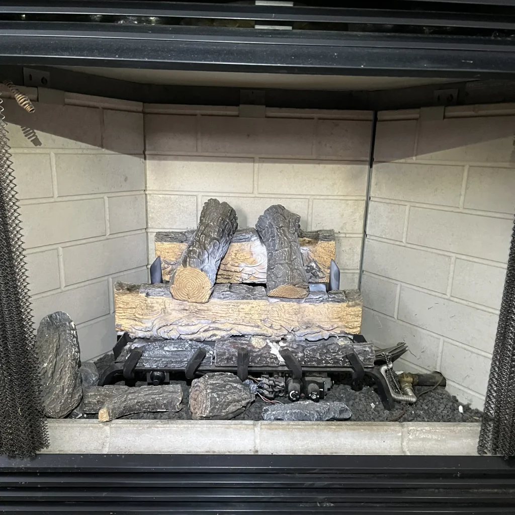 Before a gas fireplace repair in Hampton, VA.