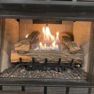 Gas fireplace with clean, repaired burner assembly and functional flame output after repair in Hampton, Virginia.