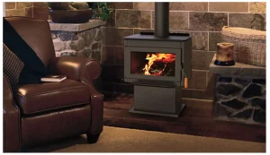 Superior F4020 freestanding steel wood burning stove with pedestal base and ceramic glass door, shown burning brightly in a modern rustic living room.