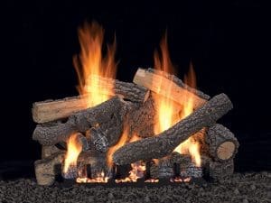 White Mountain Hearth Ponderosa vent-free gas log set on Slope Glaze burner with realistic flames and glowing embers