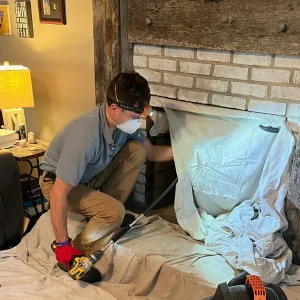 CSIA Certified Chimney Sweep performing a chimney inspection and chimney cleaning in Newport News VA